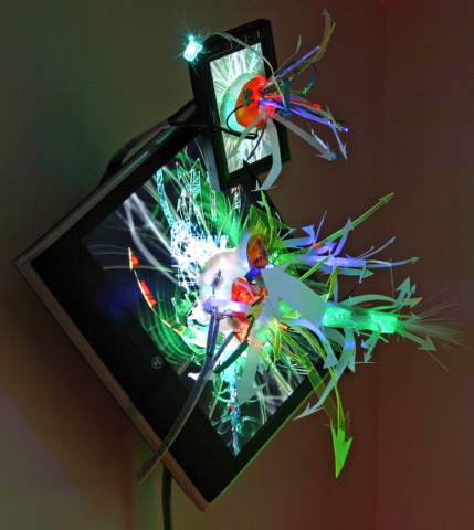 “LCD Blossom” installation view Pace University, 2007__(1) 19″ LCD screens, (1) 7″ LCD screen, fiber optics ,plastics, resin, enamel, acrylic, aluminum, airbrush paints,12 v LED’s, custom videoDVD [dNASAb]