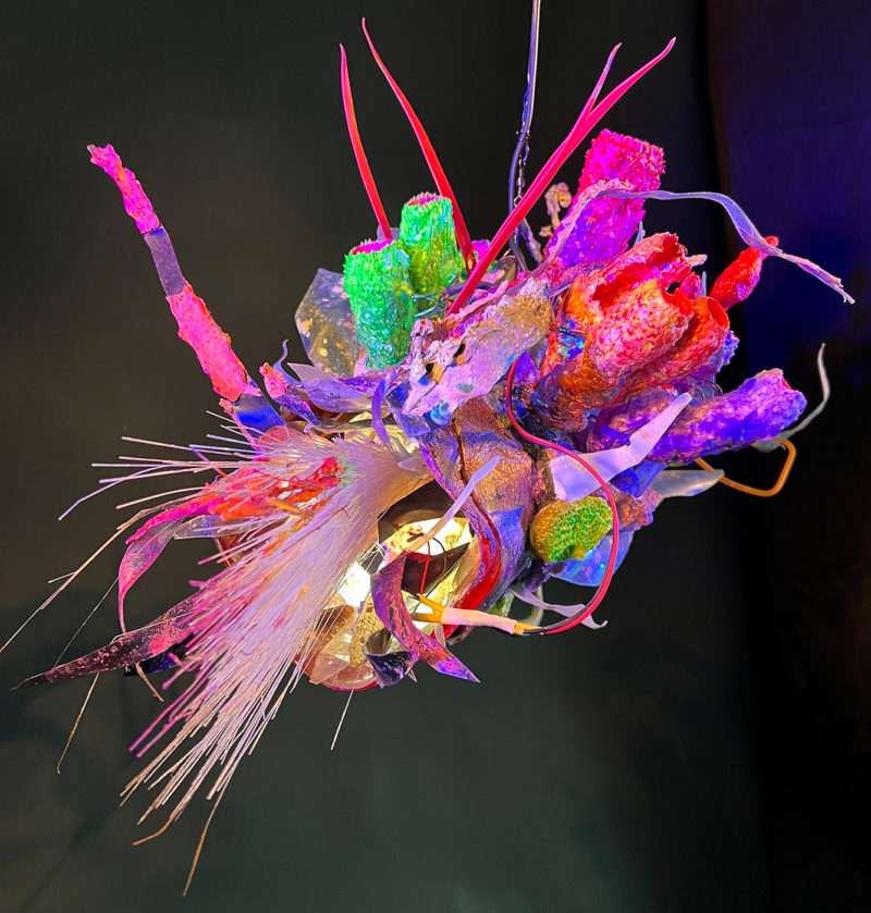"Faux Ecologies / the Anthropocene Gardens + Artificial Reefs of the Nature-verse #2" 2023 /free-hanging sculptures/ reclaimed Ocean debris [sponges,seafans, and dead corals], up-cycled plastics from beach clean-ups and the artist's personal waste stream, LED's, fiber optics, acrylic paint, epoxy by [dNASAb]