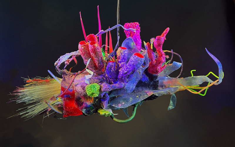 "Faux Ecologies / the Anthropocene Gardens + Artificial Reefs of the Nature-verse #2" 2023 /free-hanging sculptures/ reclaimed Ocean debris [sponges,seafans, and dead corals], up-cycled plastics from beach clean-ups and the artist's personal waste stream, LED's, fiber optics, acrylic paint, epoxy by [dNASAb]