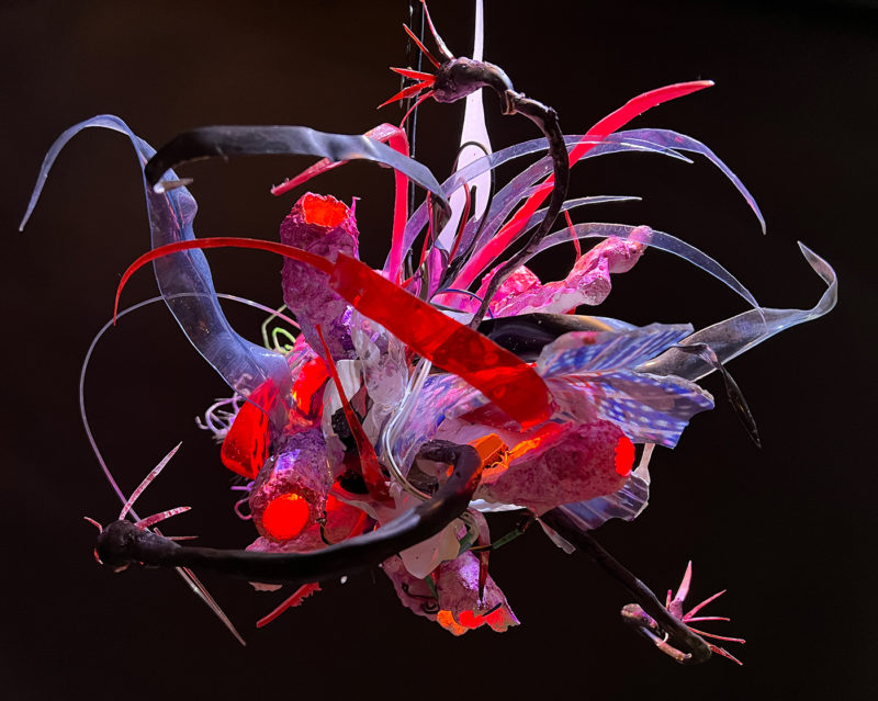 "Faux Ecologies / the Anthropocene Gardens + Artificial Reefs of the Nature-verse #7" 2014-2023 /free-hanging sculptures/ reclaimed Ocean debris [sponges,seafans, and dead corals], up-cycled plastics from beach clean-ups and the artist's personal waste stream, LED's, fiber optics, acrylic paint, epoxy by [dNASAb]